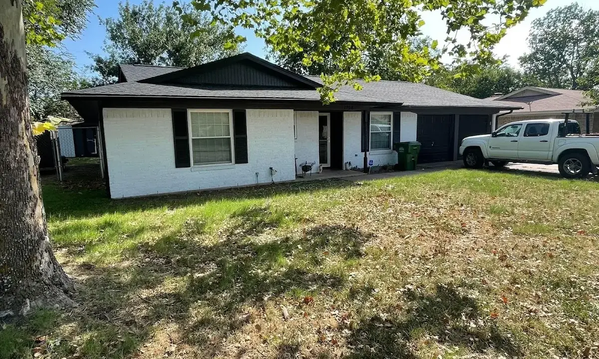 Professional roofing crew working on a residential roof in Kenosha